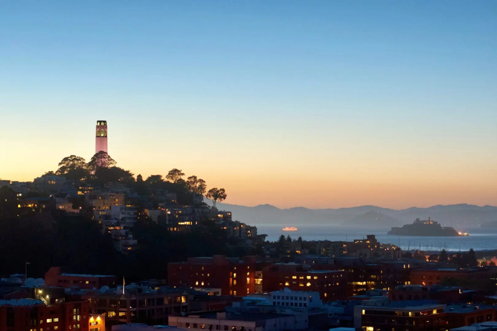 A view of the city skyline at dusk.